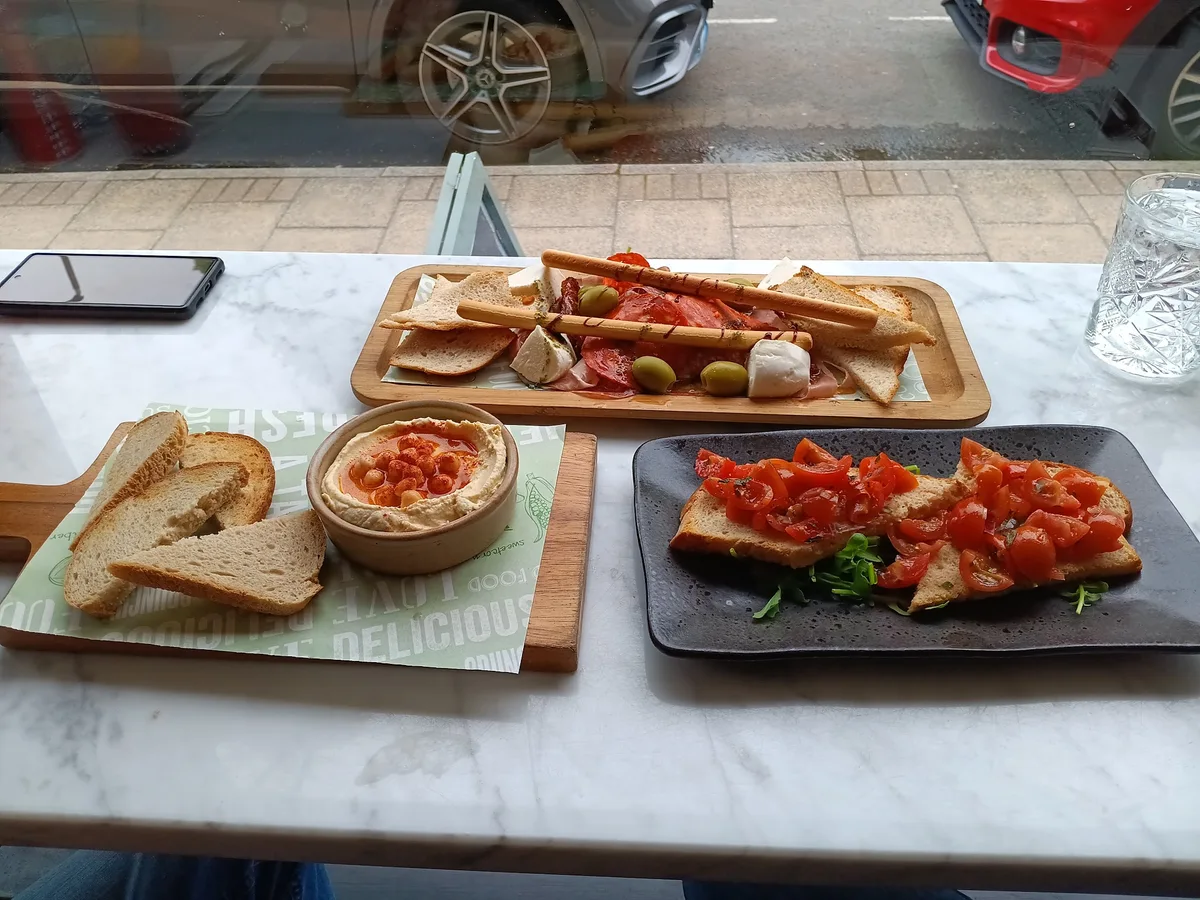 A spread of small plates on the window table at breathe